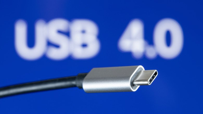 USB-C cable in front of a blue USB 4.0 background.