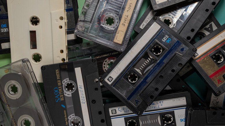 A stash of cassette tapes in a pile.