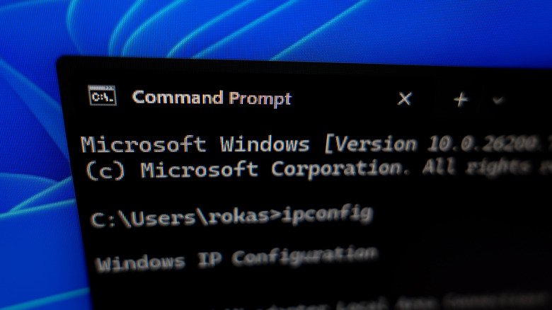 The Windows Command Prompt showing an "ipconfig" command being run.